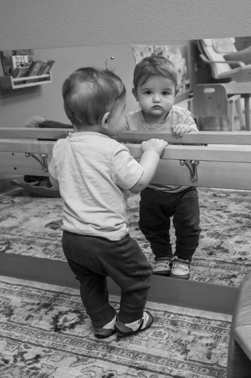 A baby exploring in the Chestnut infant room